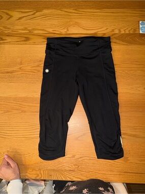 Athleta Black Capri Leggings with Small Daisy Detail